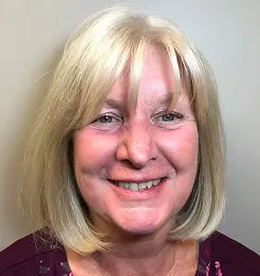 Before implant-supported dentures: deteriorated teeth and gumline